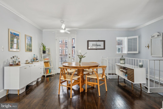 dining area featuring ceiling fan, dark wood-type flooring, and ornamental molding