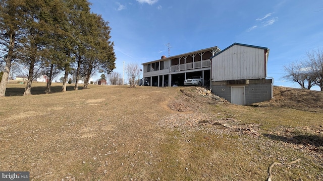 back of house with a carport