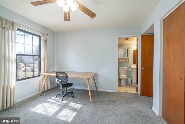 carpeted office space with baseboards