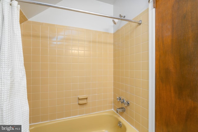 bathroom featuring shower / bathtub combination with curtain