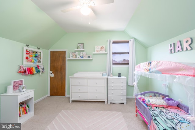 bedroom featuring lofted ceiling, baseboards, a ceiling fan, and light colored carpet