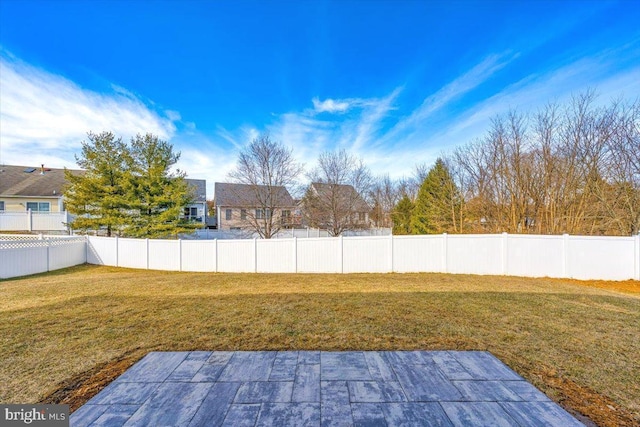 view of yard with a fenced backyard