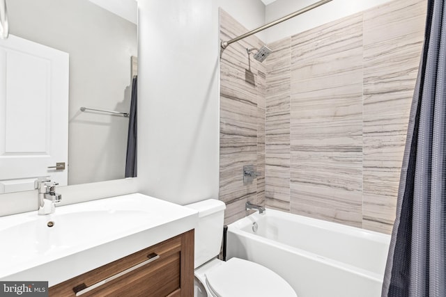 bathroom featuring shower / tub combo, vanity, and toilet