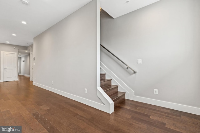 interior space with recessed lighting, wood finished floors, and baseboards