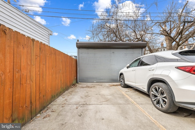 garage featuring fence