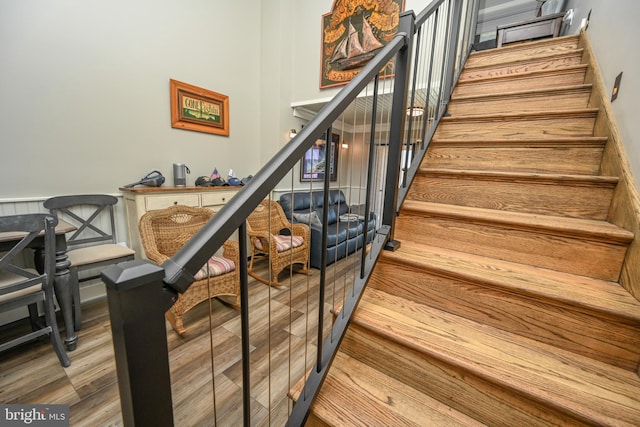 stairway featuring wood finished floors