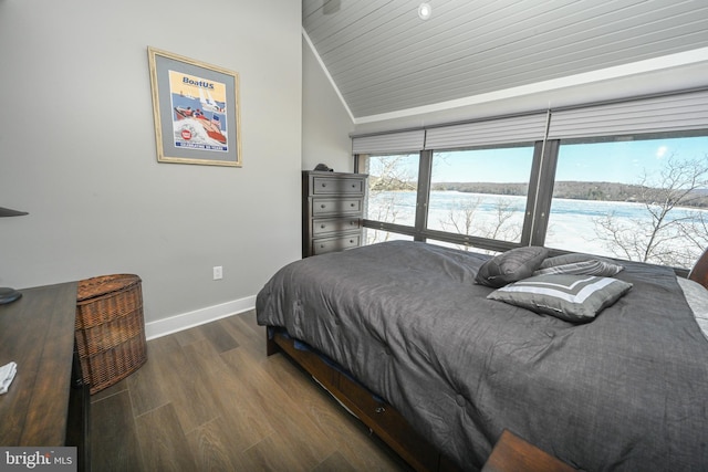 bedroom featuring dark wood-type flooring and baseboards