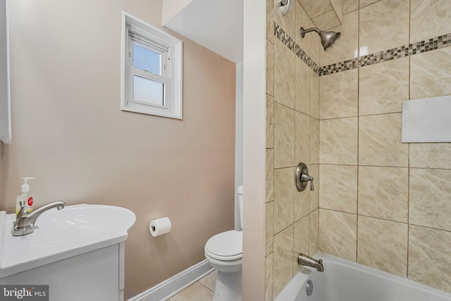 full bath featuring toilet, vanity, baseboards, tile patterned floors, and washtub / shower combination