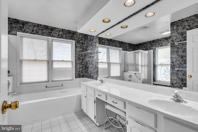 full bath with wallpapered walls, a sink, and tile patterned floors