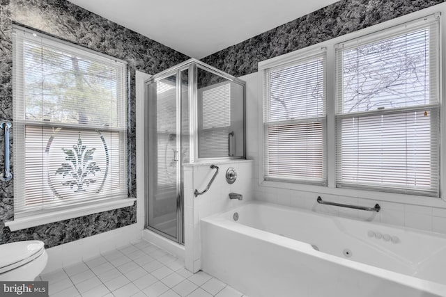 bathroom featuring a garden tub, toilet, tile patterned floors, a stall shower, and wallpapered walls