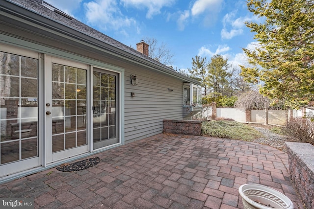 view of patio / terrace featuring fence