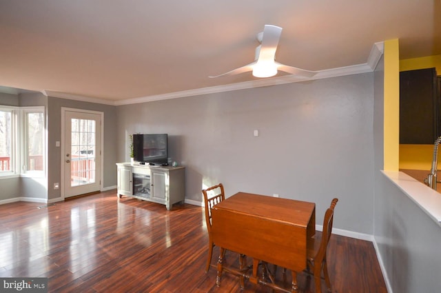 dining space featuring ceiling fan, baseboards, wood finished floors, and ornamental molding