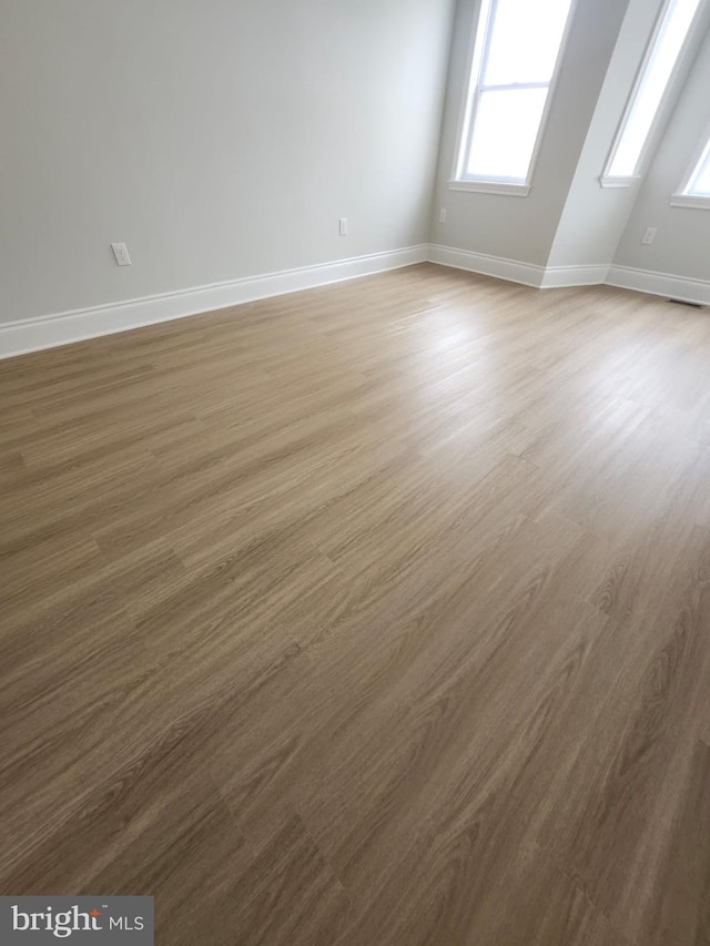 203 S Loudon Ave, Baltimore, MD 21229 - spare room featuring baseboards and wood finished floors