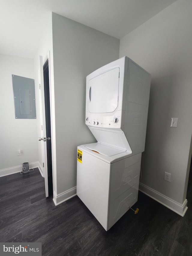 203 S Loudon Ave, Baltimore, MD 21229 - laundry room with estacked washer and dryer, electric panel, dark wood finished floors, and baseboards