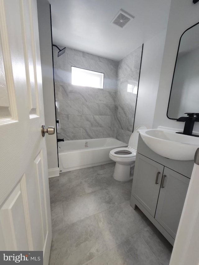 203 S Loudon Ave, Baltimore, MD 21229 - bathroom featuring vanity, toilet, and bathtub / shower combination