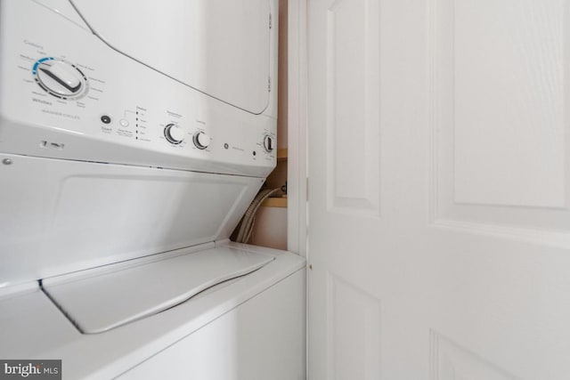 washroom with stacked washer / dryer