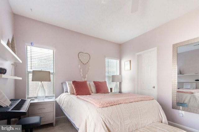 bedroom featuring ceiling fan and baseboards