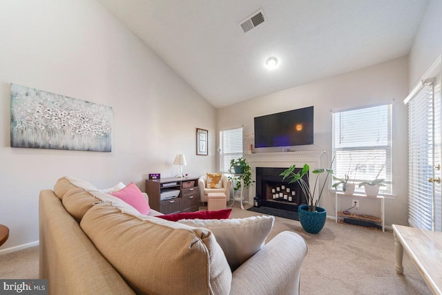 living room with baseboards, a fireplace with flush hearth, visible vents, and carpet flooring