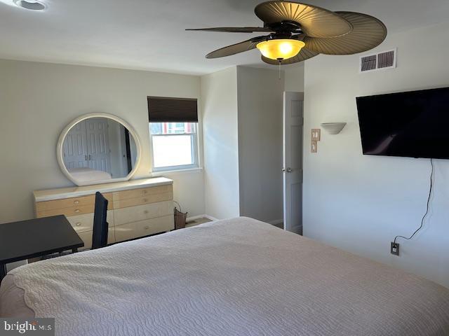 bedroom with a ceiling fan and visible vents