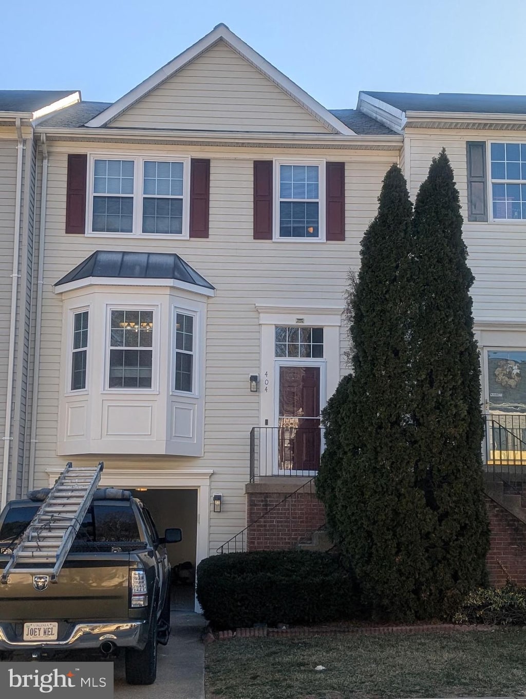 townhome / multi-family property featuring a standing seam roof