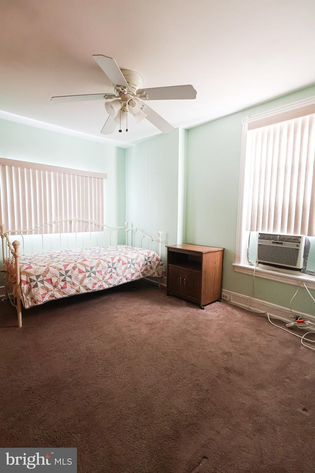 unfurnished bedroom with cooling unit, carpet flooring, and ceiling fan