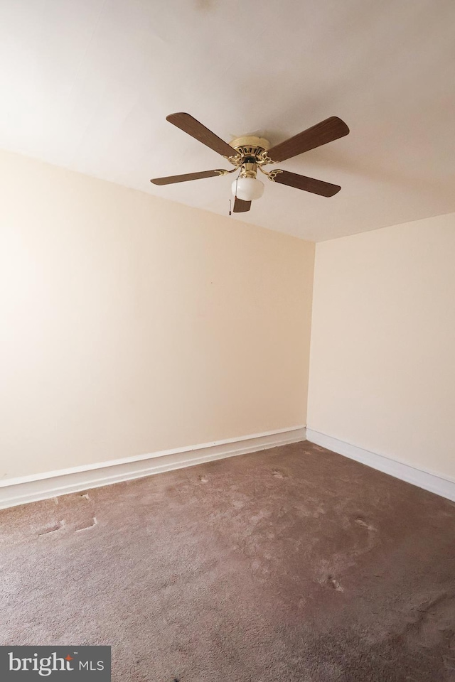 empty room featuring baseboards