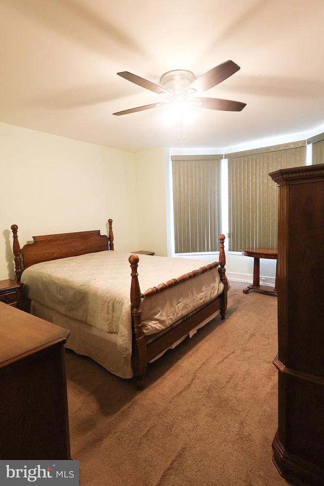 carpeted bedroom featuring a ceiling fan