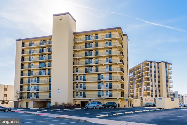 view of property featuring uncovered parking