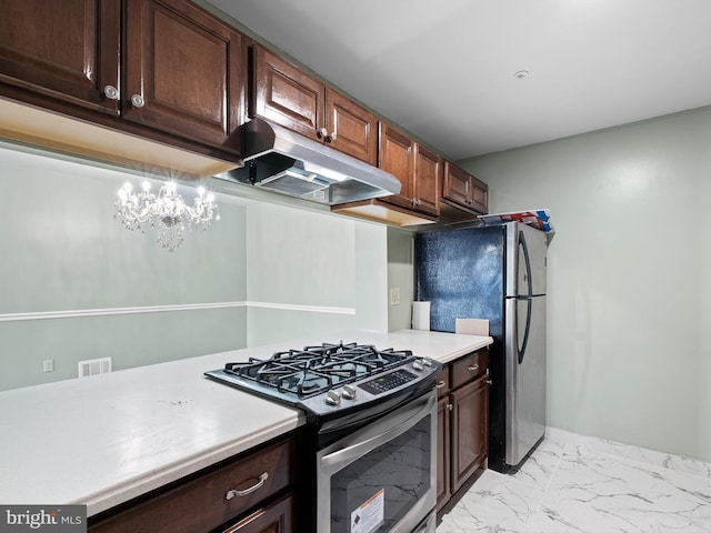 kitchen featuring marble finish floor, light countertops, appliances with stainless steel finishes, dark brown cabinetry, and under cabinet range hood