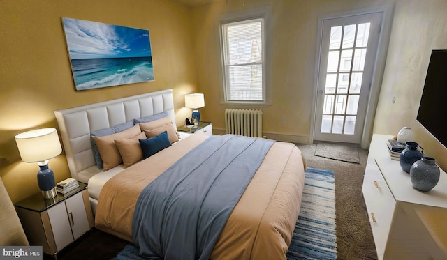 carpeted bedroom featuring radiator