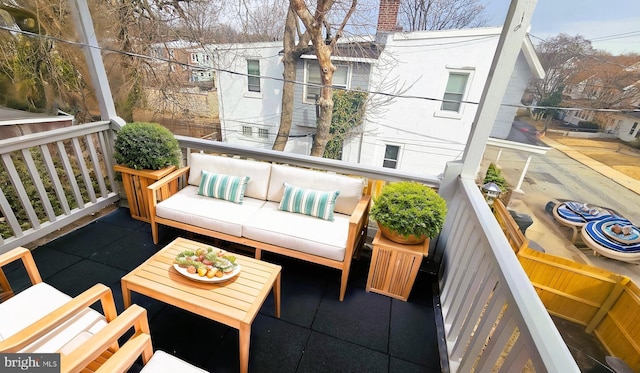 balcony with an outdoor living space and a residential view