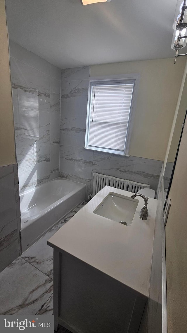 full bath with marble finish floor and vanity