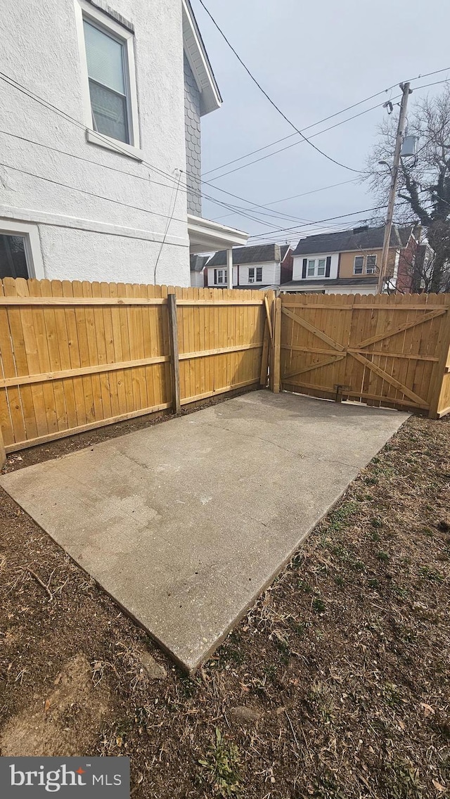 view of yard featuring a patio and fence