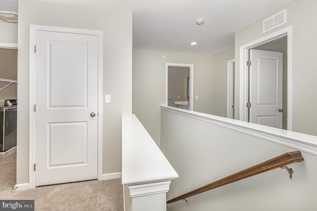 corridor with visible vents, recessed lighting, baseboards, and carpet floors