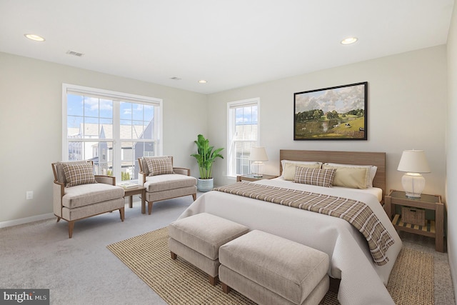 carpeted bedroom with recessed lighting, visible vents, and baseboards