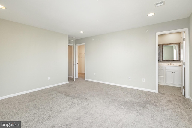 unfurnished bedroom with baseboards, visible vents, and carpet floors