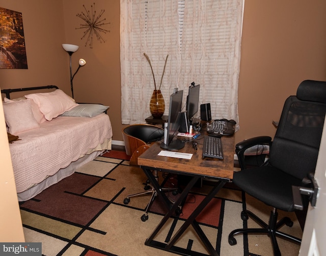 bedroom featuring baseboards