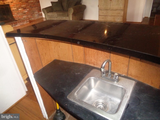 details featuring dark countertops and a sink