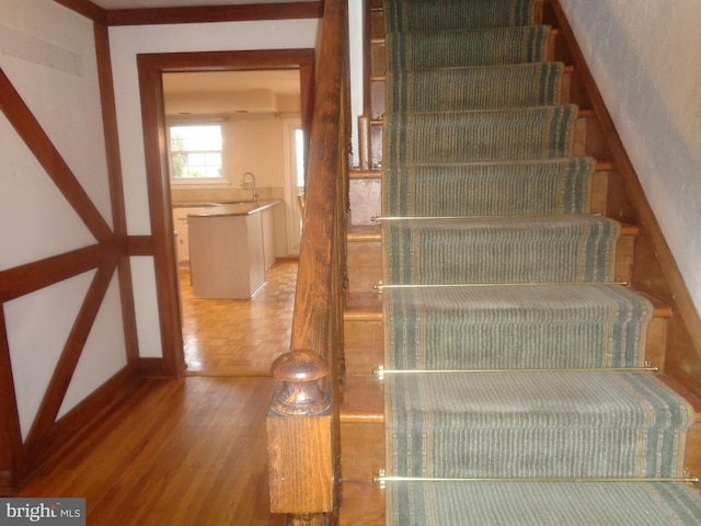 staircase with parquet flooring