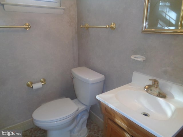 bathroom featuring toilet and vanity