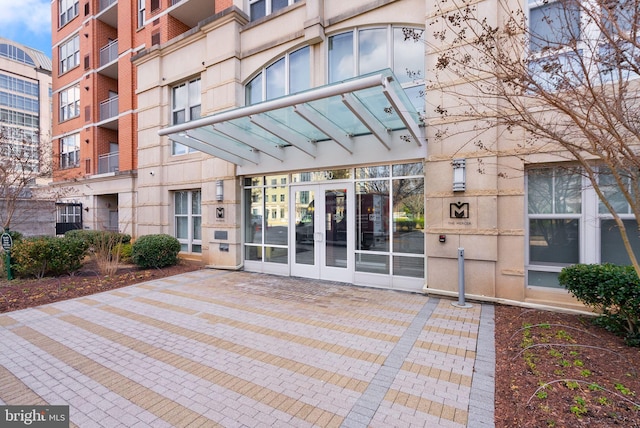 property entrance with french doors and brick siding