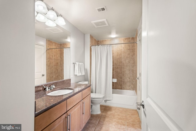 bathroom with visible vents, toilet, tile patterned floors, shower / bath combo with shower curtain, and vanity