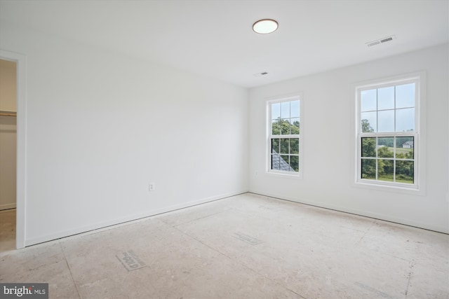 unfurnished bedroom featuring visible vents