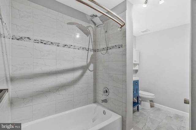 full bathroom featuring  shower combination, toilet, and baseboards