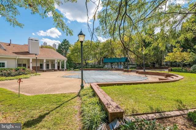 view of property's community with a lawn