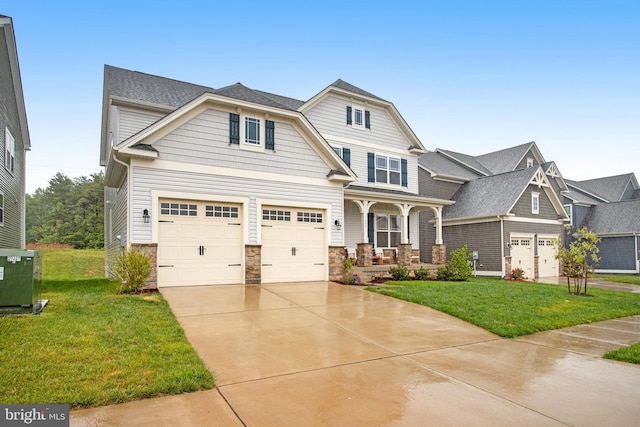 view of front of home featuring stone siding, covered porch, concrete driveway, and a front lawn