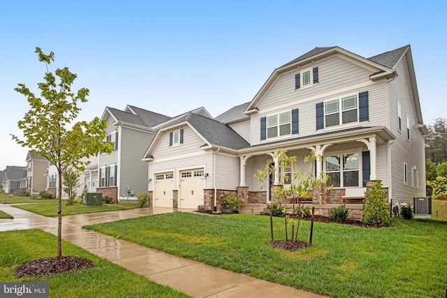 view of front of house with a front yard, cooling unit, driveway, a porch, and stone siding