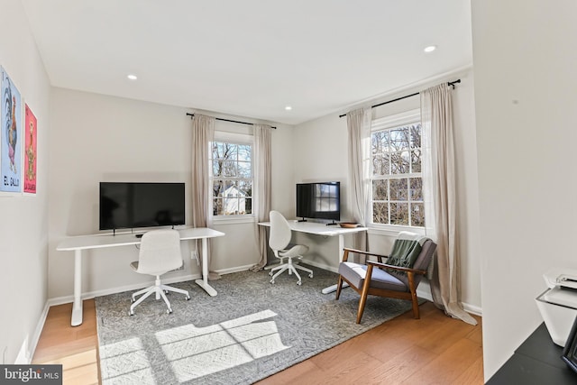 office featuring recessed lighting, wood finished floors, and baseboards