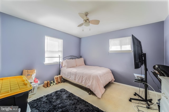 bedroom featuring carpet floors, baseboards, and a ceiling fan