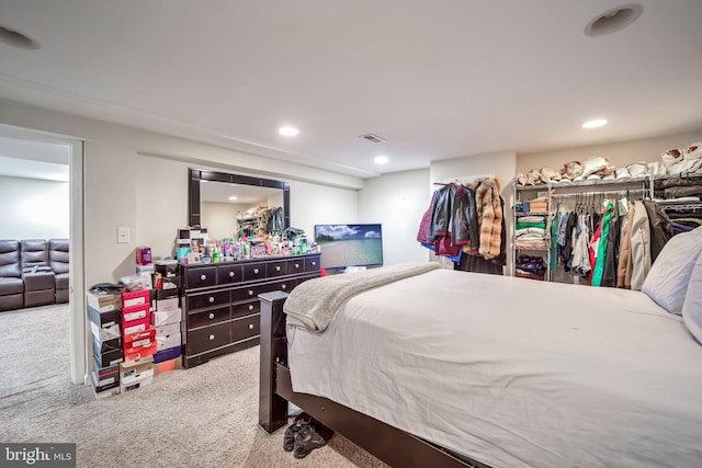 carpeted bedroom with recessed lighting and visible vents